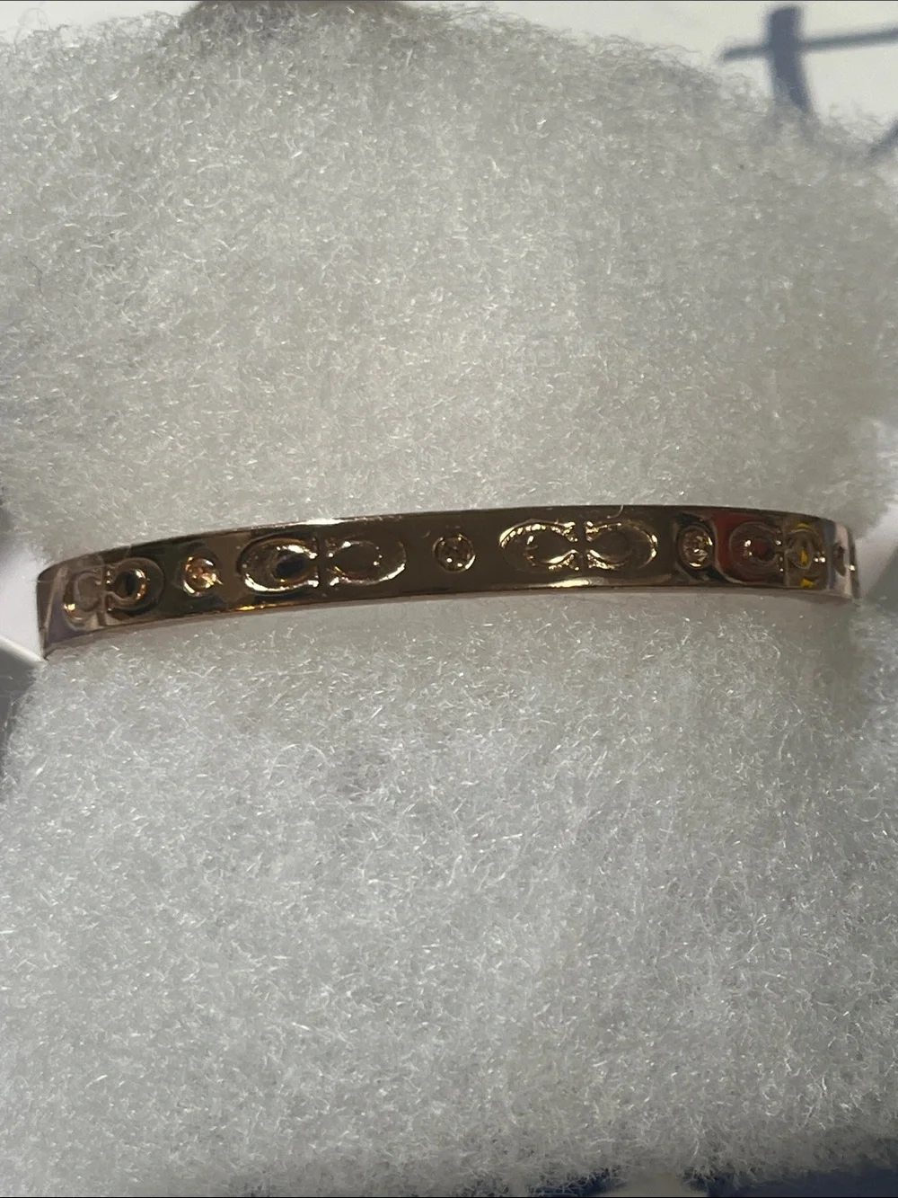 Coach Rose Gold Women's Bangle Bracelet with Engraved Motif